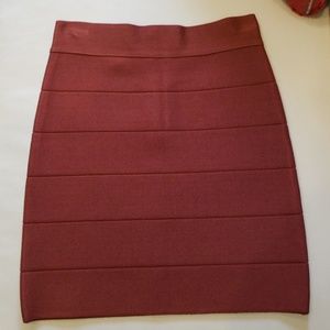 Bebe bandage skirt. Dark rust color. Size small